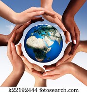 Multiracial hands making a circle together around the world glob Multiracial hands making a circle together around the world glob