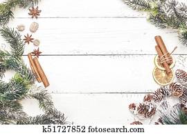 Spicy Christmas wood background with cinnamon sticks and anise stars. Top view. Copy space