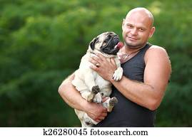 portrait of a man and his dog pug