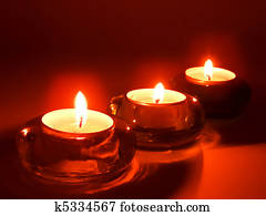 Three aroma candles in glass candlesticks