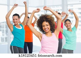 Fitness class and instructor doing pilates exercise Fitness class and instructor doing pilates exercise