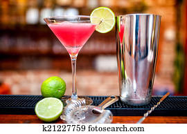 cosmopolitan cocktail drink at casino and bar served with lime