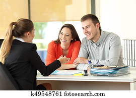 Couple being attended by office worker