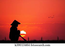 Asian farmer at sunset Asian farmer at sunset