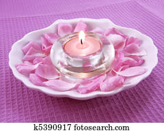 Aroma candle and petals of rose 