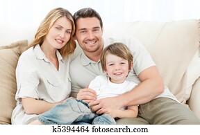 Happy family on their sofa Happy family on their sofa