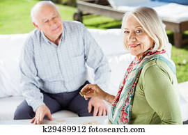 Portrait Of Senior Woman Holding Dominoes Cube Portrait Of Senior Woman Holding Dominoes Cube