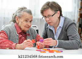 Senior woman with her elder care nurse