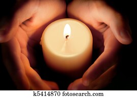 candle between the hands