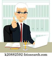 Senior Businessman Working At Office