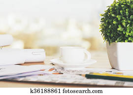 Desk with coffee and plant