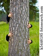 Humorous collage - man climbs up a tree
