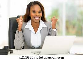 african american businesswoman waving fists