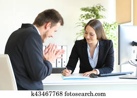 Businesspeople signing contract after deal