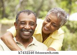 Senior Couple Outdoors Hugging