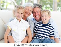 Happy family looking at the camera Happy family looking at the camera