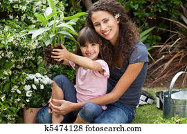 Mother and daughter working in the garden