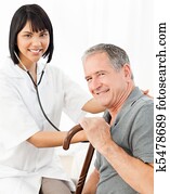 Nurse with her patient looking at the camera