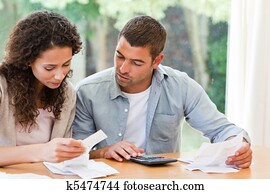 Young couple calculating their dome