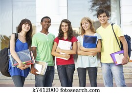 Group Of Teenage Students Standing Outside College Building