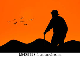 Old Man Walking at Sunset