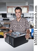 Happy owner of a computer repair store Happy owner of a computer repair store