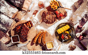 Seasonal winter barbecue in snow Seasonal winter barbecue in snow