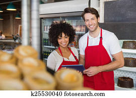 Smiling colleagues holding tablet pc Smiling colleagues holding tablet pc