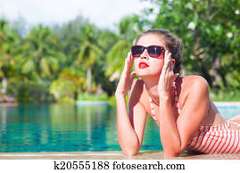 Couple walking and having fun on a tropical beach at Maldives