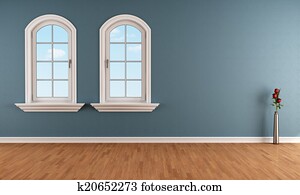 Blue room with two arched windows Blue room with two arched windows