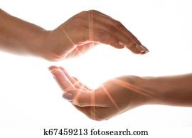 light in the hands isolated on white background