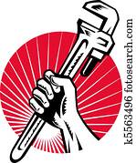 Plumber hand holding monkey wrench Plumber hand holding monkey wrench
