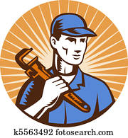 Plumber holding monkey wrench Plumber holding monkey wrench