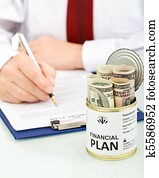 Concept of business man making financial plan - closeup