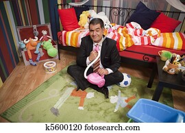 Mature man playing with toys