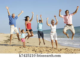 Portrait Of Three Generation Family On Beach Holiday Jumping In Air Portrait Of Three Generation Family On Beach Holiday Jumping In Air