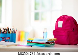 Backpack of school child. Face mask and sanitizer. Backpack of school child. Face mask and sanitizer.
