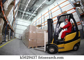 Forklift loader working in warehous