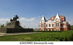 Building of the Drama Theatre, built in traditional Russian style and monument to the cavalry. Urban landscape. Russia, Samara.