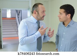 supervisor giving speech to his intern supervisor giving speech to his intern