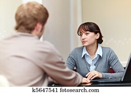 Boss talking to her employee Boss talking to her employee