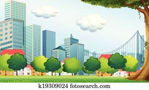 Trees near the tall buildings Trees near the tall buildings
