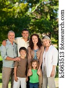 Family looking at the camera in the park Family looking at the camera in the park