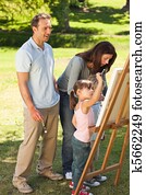 Family painting together in the park Family painting together in the park