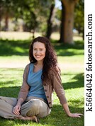 Lovely woman sitting in the garden