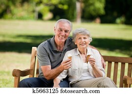 Senior couple eating an ice cream o