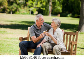 Senior couple eating an ice cream o