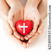 couple hands holding heart with cross symbol couple hands holding heart with cross symbol
