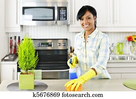 mulher jovem, limpeza, cozinha