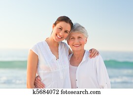 Smiling daughter with her mother Smiling daughter with her mother